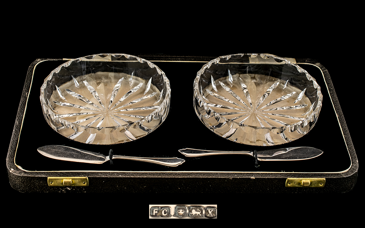 A Boxed Pair of Cut Glass Circular Sweetmeat Dishes with a Pair of Sterling Silver Small Knives -
