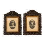 A Pair of Antique Carved Asian Picture Frames. The frames are heavily carved, depicting figures,