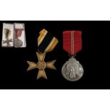 Two German WWll Medals, one Merit Cross and one Winter Campaign Medal (2)