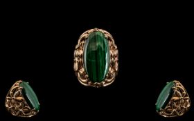 Large Malachite Ring, an elongated oval, cabochon cut malachite, of rich green with typical