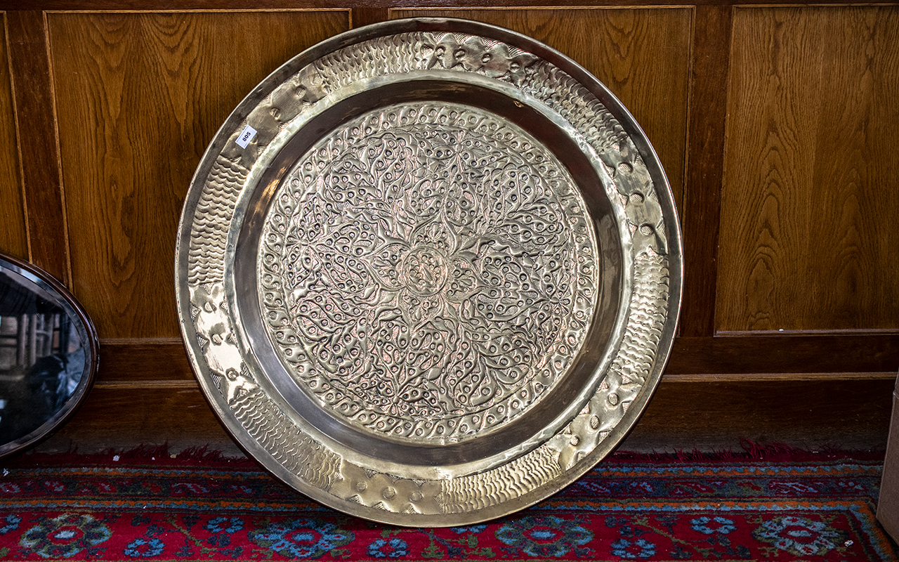 Large Antque Oriental Embossed Brass Dish with a floral design, 36 inches (90cms) in diameter