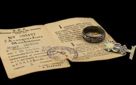 German SS Ring and Pin Badge plus paperwork; German Nazi ring of large size and enamelled pin