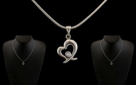 18ct White Gold - Contemporary Diamond Set Pendant - Attached to a 18ct White Gold Chain of Good