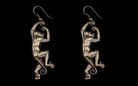 Chinese Silver Earrings in the form of hanging monkeys, each of 6cm drop