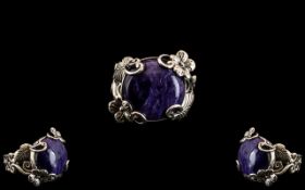 Charoite Solitaire Ring, a 12.75ct cabochon cut charoite set in a decorative, hand crafted, silver