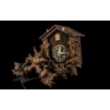 Vintage Carved Wood Cuckoo Clock with bird and leaf decoration to pitched top, and leaf and nest