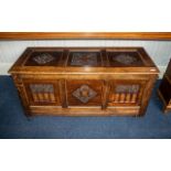 Reproduction Carved Oak Mule Chest with a Three Paneled Lift up Lid and Parcels to the Front..