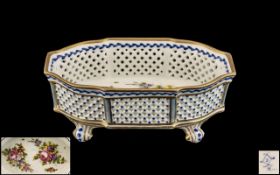 French Sevres Porcelain Reticulated Basket Decorated with Flowers, Terminating on Scroll Feet.