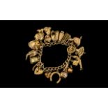 9ct Gold Curb Bracelet Loaded with ( 20 ) 9ct Gold Charms. c.1960's.