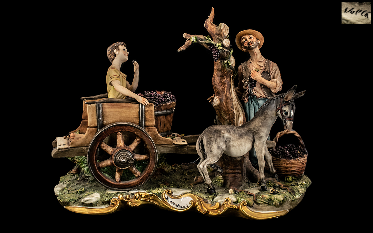 Capodimonte Figure "La Vendemmia" depicting a boy on a cart with grapes, pulled by a donkey,