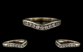 9ct White Gold Contemporary Wishbone Design Diamond Set Ring. Fully hallmarked for 9ct. Cal. diamond