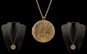 A Large and Impressive 9ct Gold Circular Hinged Locket with Engraved Decoration to Front Cover,
