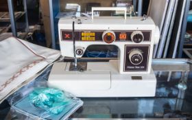 Sewing Machine - Frister & Rossmann Star 101, with instruction manual and cover.