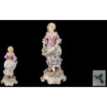 Sitzendorf Hand Painted Porcelain Figure depicting a young lady in 19thC dress,