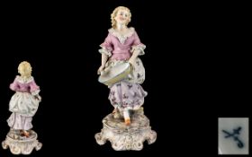 Sitzendorf Hand Painted Porcelain Figure depicting a young lady in 19thC dress,