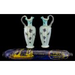 Pair of Victorian Decorated Blue Glass Jugs with Shaped Handles.