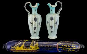 Pair of Victorian Decorated Blue Glass Jugs with Shaped Handles.