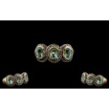 10ct Gold Attractive 3 Stone Aquamarine Set Dress Ring. Marked 10ct.