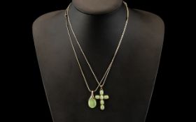 Two Silver Necklaces with green stones, a cross decorated with six green stones, and a drop