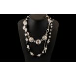 Saks of London Silver Tone Necklace No. SKN1943, shell like ripple effect large discs with small