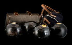 Two Sets of Crown Green Bowls in carrying cases.