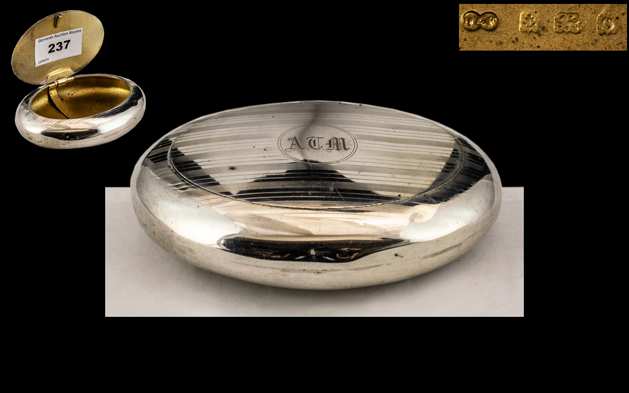 A Silver Squeeze Tobacco Box of typical oval/round form. Hallmarked for Birmingham O 1938.