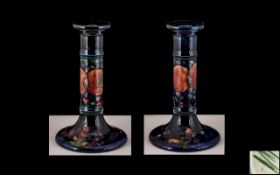 William Moorcroft Signed Pair of Candlesticks of Large Proportions ' Pomegranate ' Design on Blue