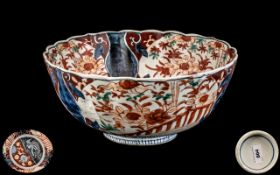 Antique Japanese Fluted Imari Bowl Decorated In the Unusual Palette of Blues and Red Hues.
