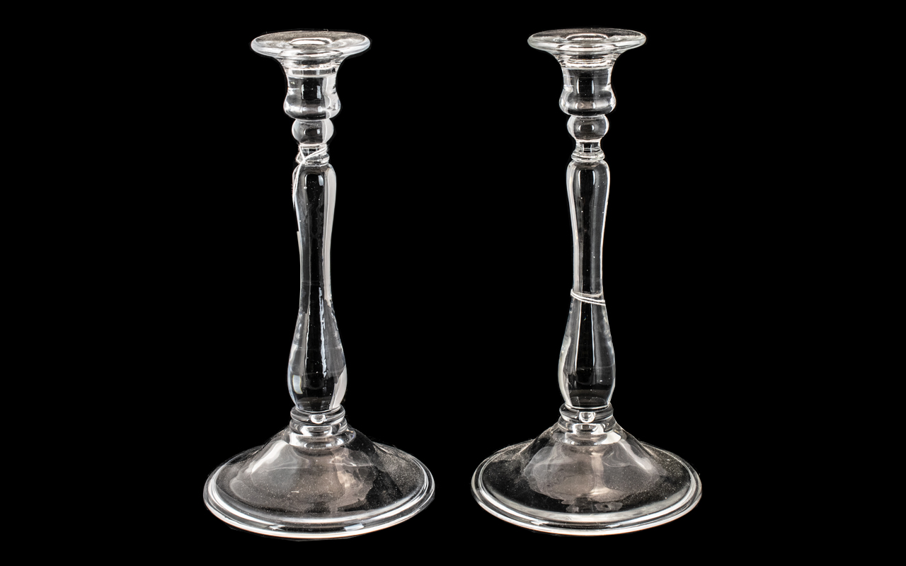Pair of Glass Candlesticks with a Fold Over Foot, Supported on a Baluster Stem. 10 Inches High.