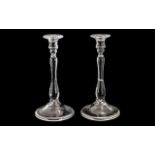 Pair of Glass Candlesticks with a Fold Over Foot, Supported on a Baluster Stem. 10 Inches High.