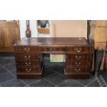 A Mahogany Effect Leather Topped Twin Pedestal Desk, with three frieze drawers,