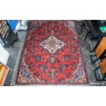 A Genuine Excellent Quality Persian Sarouk Carpet/Rug decorated in a traditional floral design on