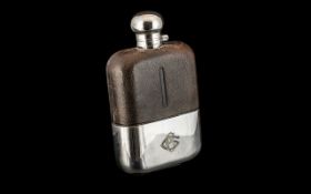 A Jumbo Size Gentleman's Silver Plated Hip Flask, with a leather clad body,