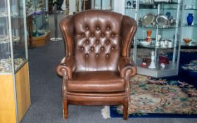 Gents Wing Back Chesterfield Armchair in brown, with lovely age patination,