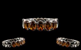 Madeira Citrine Band Ring, five oval cut, deep, warm Madeira citrines totalling 2cts,
