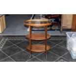 A Mahogany Three Tier Edwardian What Not, oval tiers with lift of tray top,