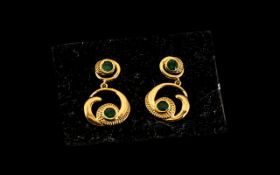 Emerald 'Wave and Circle' Drop Earrings, each earring comprising a deep green emerald set in a