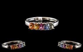 Multi Colours of Sapphire Band Ring, a row of oval cut sapphires, comprising one each of orange,