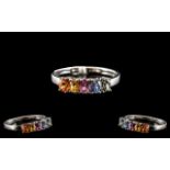 Multi Colours of Sapphire Band Ring, a row of oval cut sapphires, comprising one each of orange,