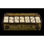 Advertising Interest early 20th century domino set in original box, made by E.M. patent number 8436.
