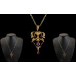 Edwardian Period 9ct Gold Openwork Pendant set with amethysts of attractive appearance,