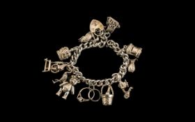 Silver Curb Bracelet Loaded with ( 12 ) Excellent Sterling Silver Charms.