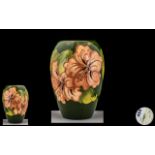 Moorcroft - Tubelined Ovoid Shaped Vase ' Coral Hibiscus ' Design on Green Ground.