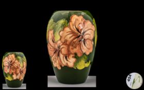 Moorcroft - Tubelined Ovoid Shaped Vase ' Coral Hibiscus ' Design on Green Ground.