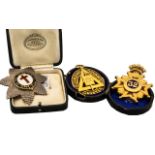 Three Masonic Breast Badges comprising 'In Hoc Signo Vinces' silver and enamel breast badge,