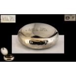 A Silver Squeeze Tobacco Box of typical oval/round form. Hallmarked for Birmingham Q 1898.