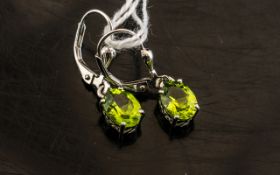 Peridot Solitaire Drop Earrings, oval cut peridot solitaires totalling 2.