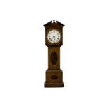 A Novelty Edwardian Mahogany Clock in the form of a long case clock, white enamel dial,