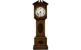 A Novelty Edwardian Mahogany Clock in the form of a long case clock, white enamel dial,