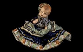 1920's Celluloid Doll In Its Original Clothing and Bonnet, Overall Length 12 Inches.